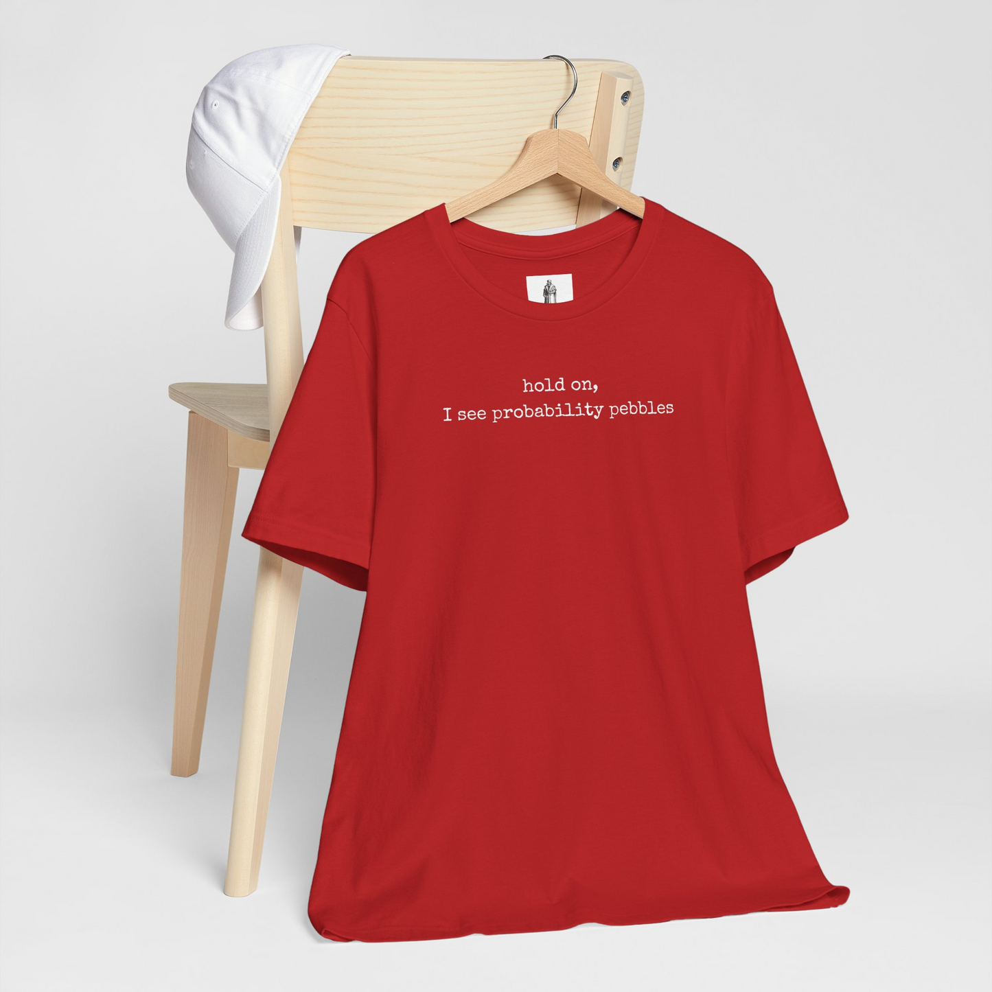 Hold On I See Probability Pebbles Unisex Tee